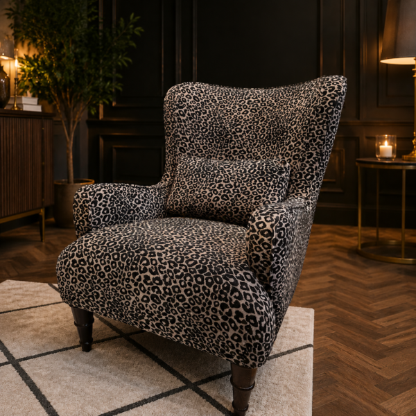 Howarth Leopard Armchair upholstered in Wild 235 luxury woven leopard fabric with a high wingback design and solid wood legs at Amadi Home